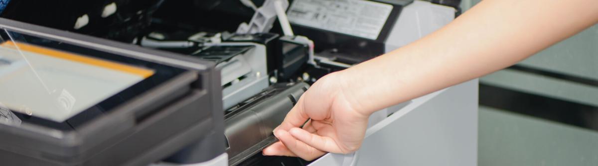 Woman repairing a copier